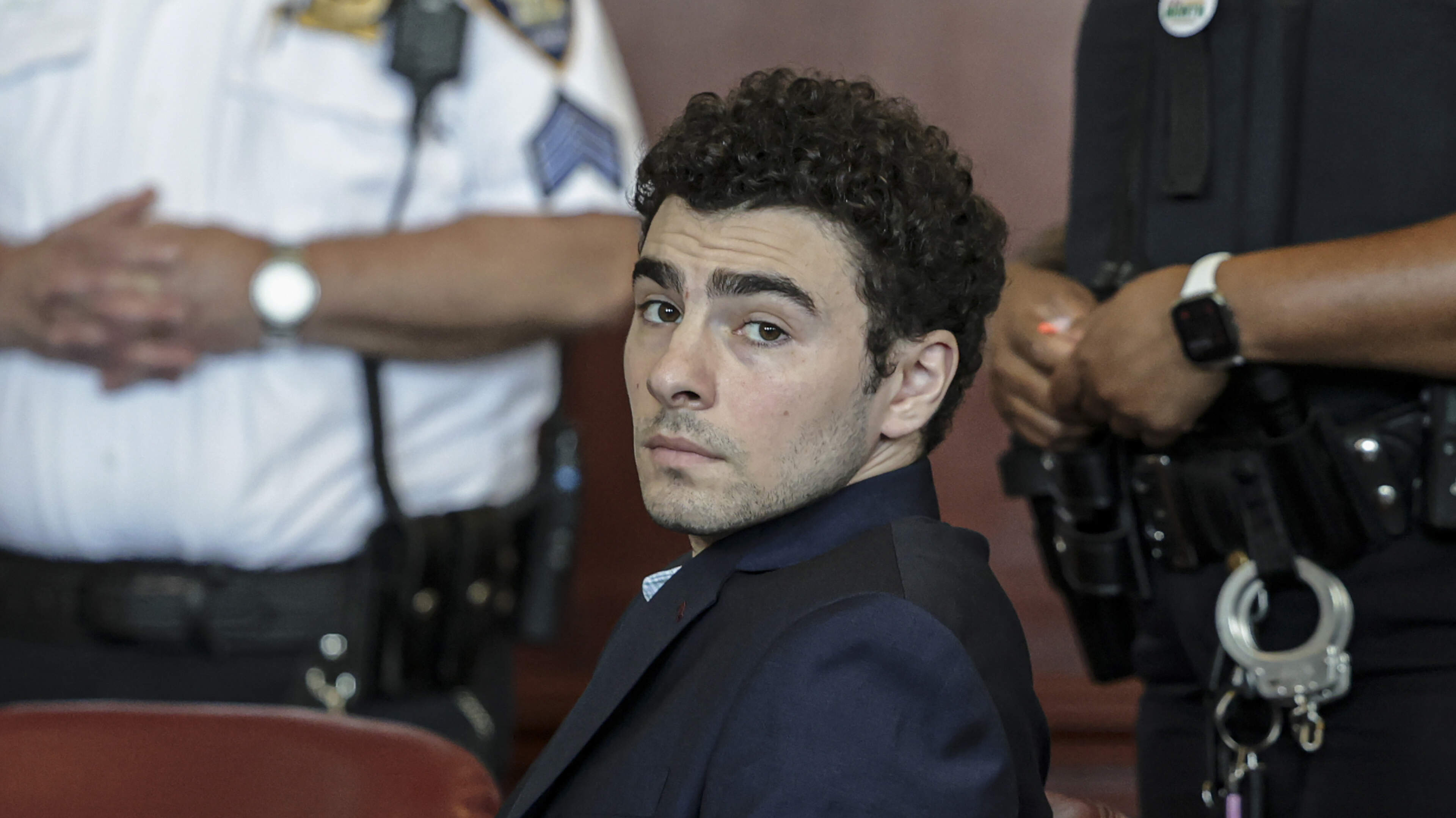 Luigi Mangione pleads guilty to federal stalking charges in case over killing of healthcare CEO